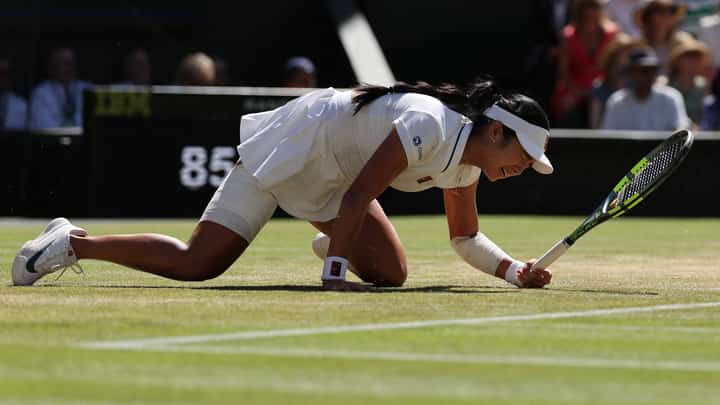 ALEX Eala tumbles to the grass while chasing down a shot during her women's singles Round of 16 clash against Italy's Jasmine Paolini on the eighth day of the 2026 Wimbledon Championships at the All England Lawn Tennis and Croquet Club in Wimbledon, southwest London, on Monday. The fall captured the grit and determination of the young Filipina, who fought until the final point in her historic Wimbledon campaign.