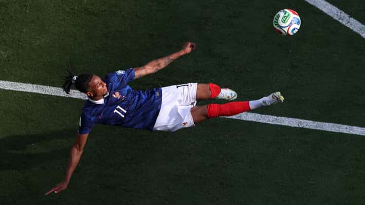 Michael Olise performs an acrobatic bicycle kick during the France-Sweden match in East Rutherford, New Jersey, on June 30, 2026