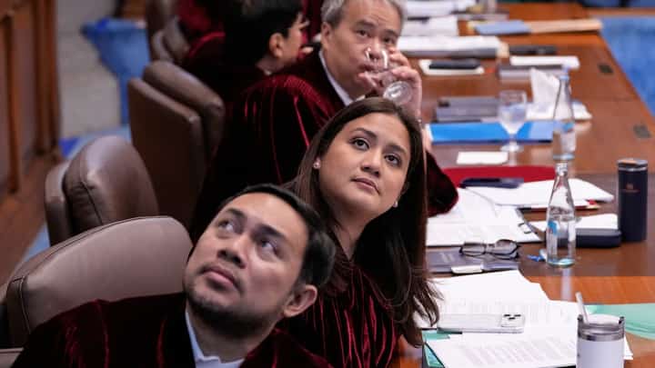 SENATORS Mark Villar, Camille Villar and Joel Villanueva closely examine documentary evidence presented during the impeachment trial of Vice President Sara Duterte at the Senate in Pasay City on Tuesday as the historic proceedings entered another crucial day with prosecutors laying out key evidence before the impeachment court.