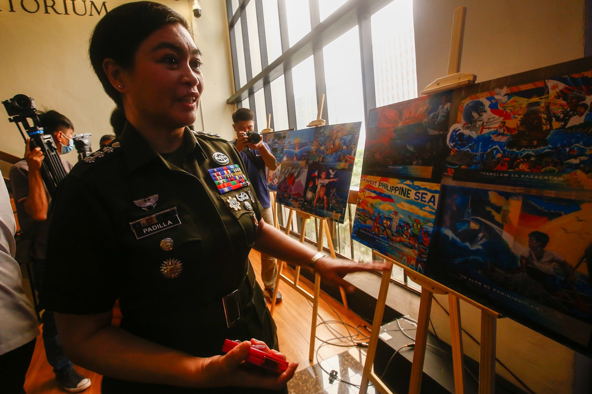 Visitors view reproductions of the mural entries for the WPS Mural Festival 2026 at the National Library in Manila on 07 July 2026, where the 100 finalists from across the country were unveiled. The festival coincides with the Philippines' commemoration of the 10th anniversary of the landmark 2016 arbitral award, which invalidated China's expansive claims in the South China Sea under the United Nations Convention on the Law of the Sea (UNCLOS).

Secretary of National Defense Gilbert Teodoro, retired Supreme Court Justice Antonio Carpio, Presidential Communications Office Undersecretary Claire Castro, Philippine Coast Guard Rear Admiral Jay T. Tarriela, Colonel Ma. Consuelo "Bon" Nunag-Castillo, documentary director Baby Ruth Villarama of Food Delivery, and other guests attend the unveiling of the finalists.