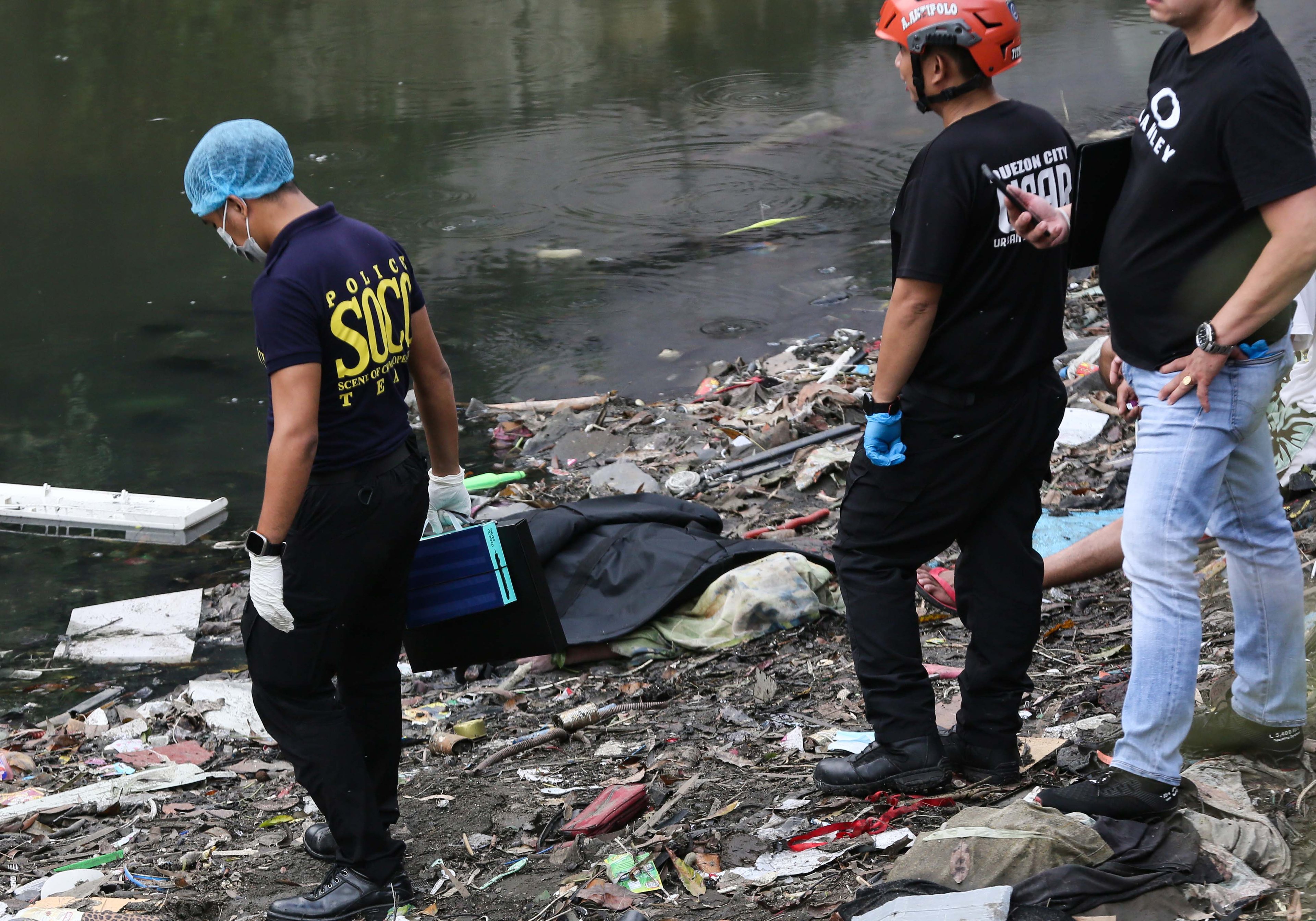 (July 07 2026) Scene of the Crime Operative SOCO investigate the lifeless body of the seven year old boy allegedly fell off at Dario river while flying a kite at Brgy. Bahay Toro in Quezon City on Monday afternoon, due to heavy rain and the water flow going strong the body was found at San Juan river in Brgy Apolonio Samson, Quezon City. Photo/Analy Labor