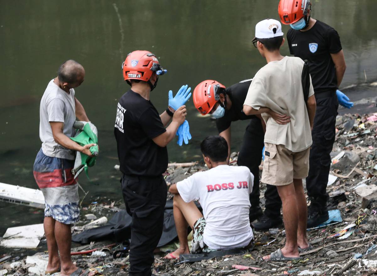 (July 07 2026) Scene of the Crime Operative SOCO investigate the lifeless body of the seven year old boy allegedly fell off at Dario river while flying a kite at Brgy. Bahay Toro in Quezon City on Monday afternoon, due to heavy rain and the water flow going strong the body was found at San Juan river in Brgy Apolonio Samson, Quezon City. Photo/Analy Labor