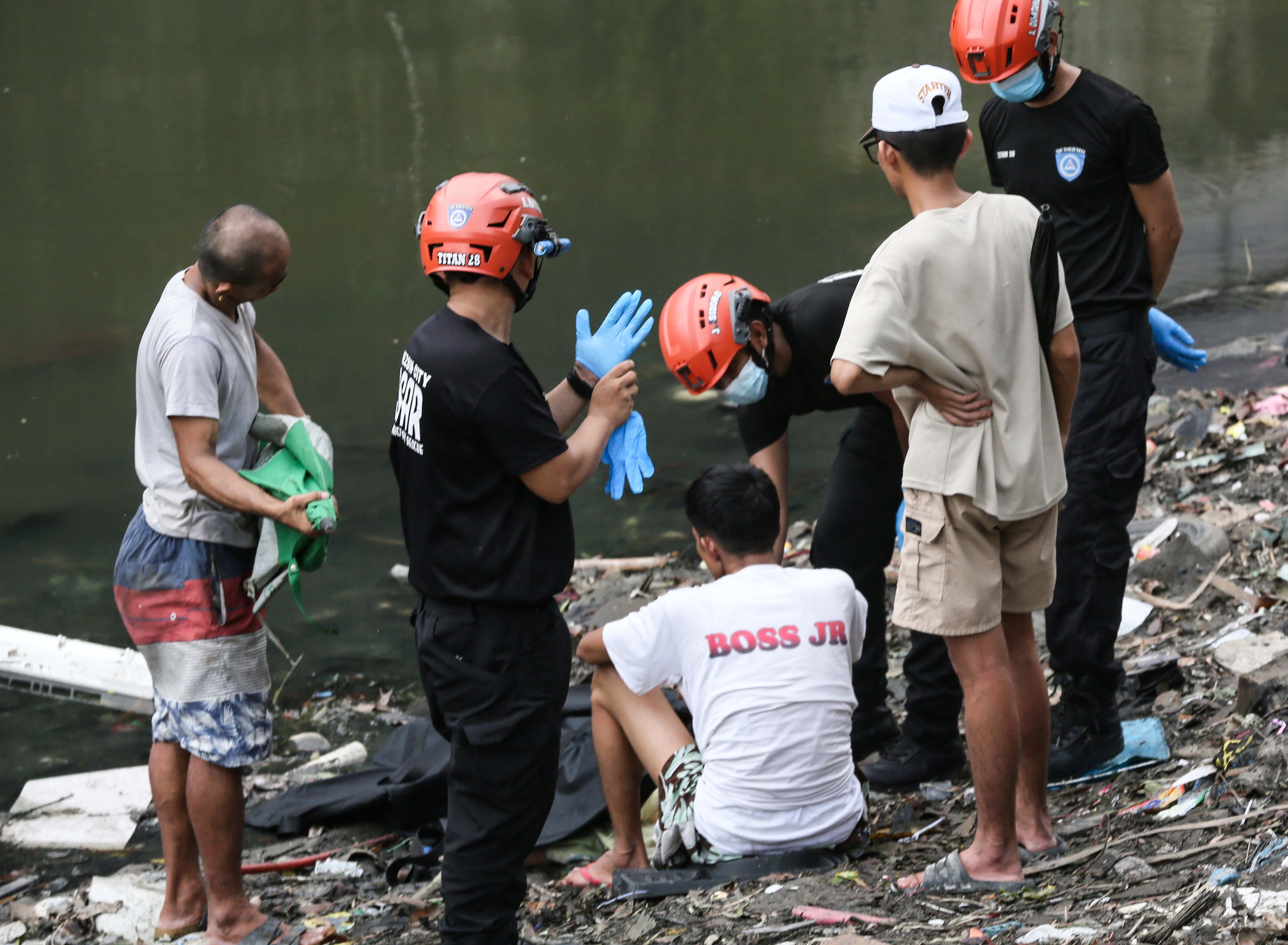 (July 07 2026) Scene of the Crime Operative SOCO investigate the lifeless body of the seven year old boy allegedly fell off at Dario river while flying a kite at Brgy. Bahay Toro in Quezon City on Monday afternoon, due to heavy rain and the water flow going strong the body was found at San Juan river in Brgy Apolonio Samson, Quezon City. Photo/Analy Labor