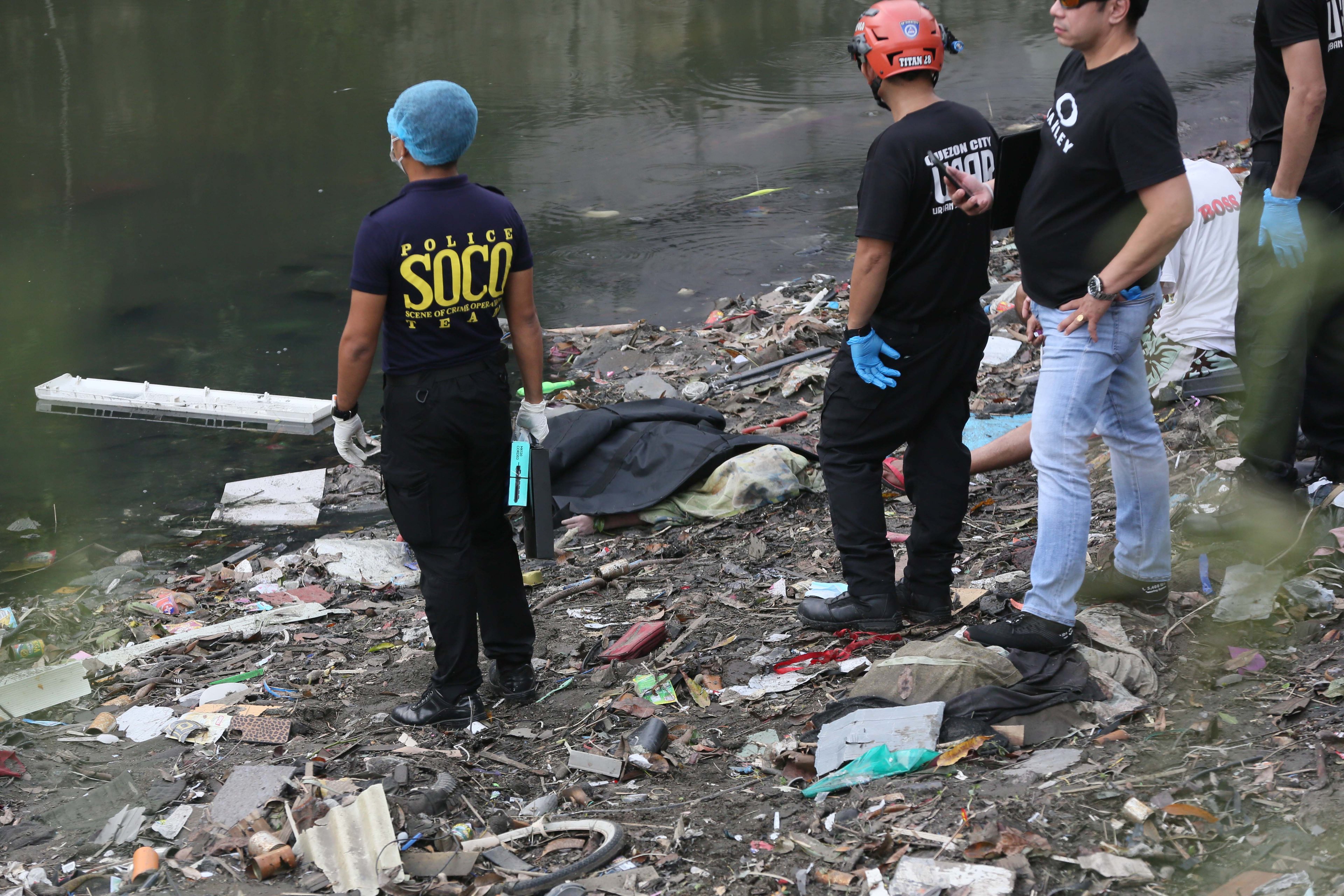 (July 07 2026) Scene of the Crime Operative SOCO investigate the lifeless body of the seven year old boy allegedly fell off at Dario river while flying a kite at Brgy. Bahay Toro in Quezon City on Monday afternoon, due to heavy rain and the water flow going strong the body was found at San Juan river in Brgy Apolonio Samson, Quezon City. Photo/Analy Labor