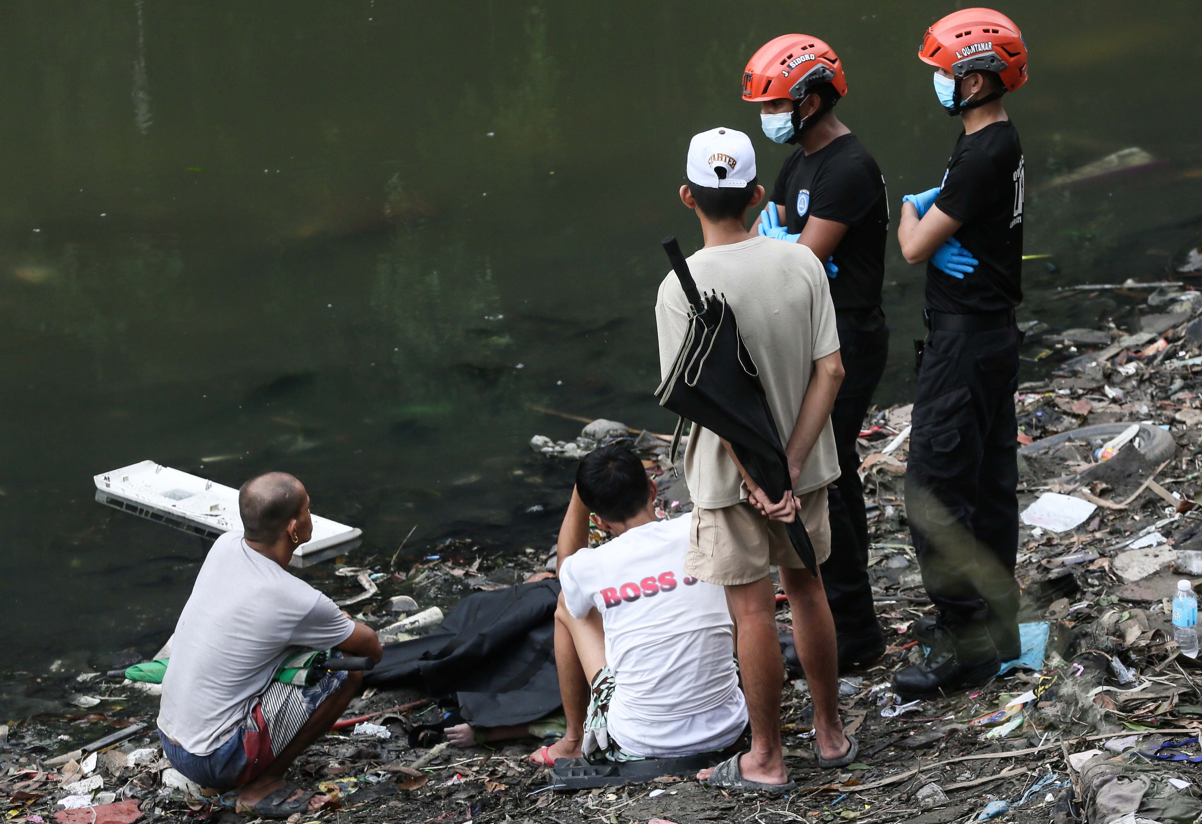 (July 07 2026) Scene of the Crime Operative SOCO investigate the lifeless body of the seven year old boy allegedly fell off at Dario river while flying a kite at Brgy. Bahay Toro in Quezon City on Monday afternoon, due to heavy rain and the water flow going strong the body was found at San Juan river in Brgy Apolonio Samson, Quezon City. Photo/Analy Labor