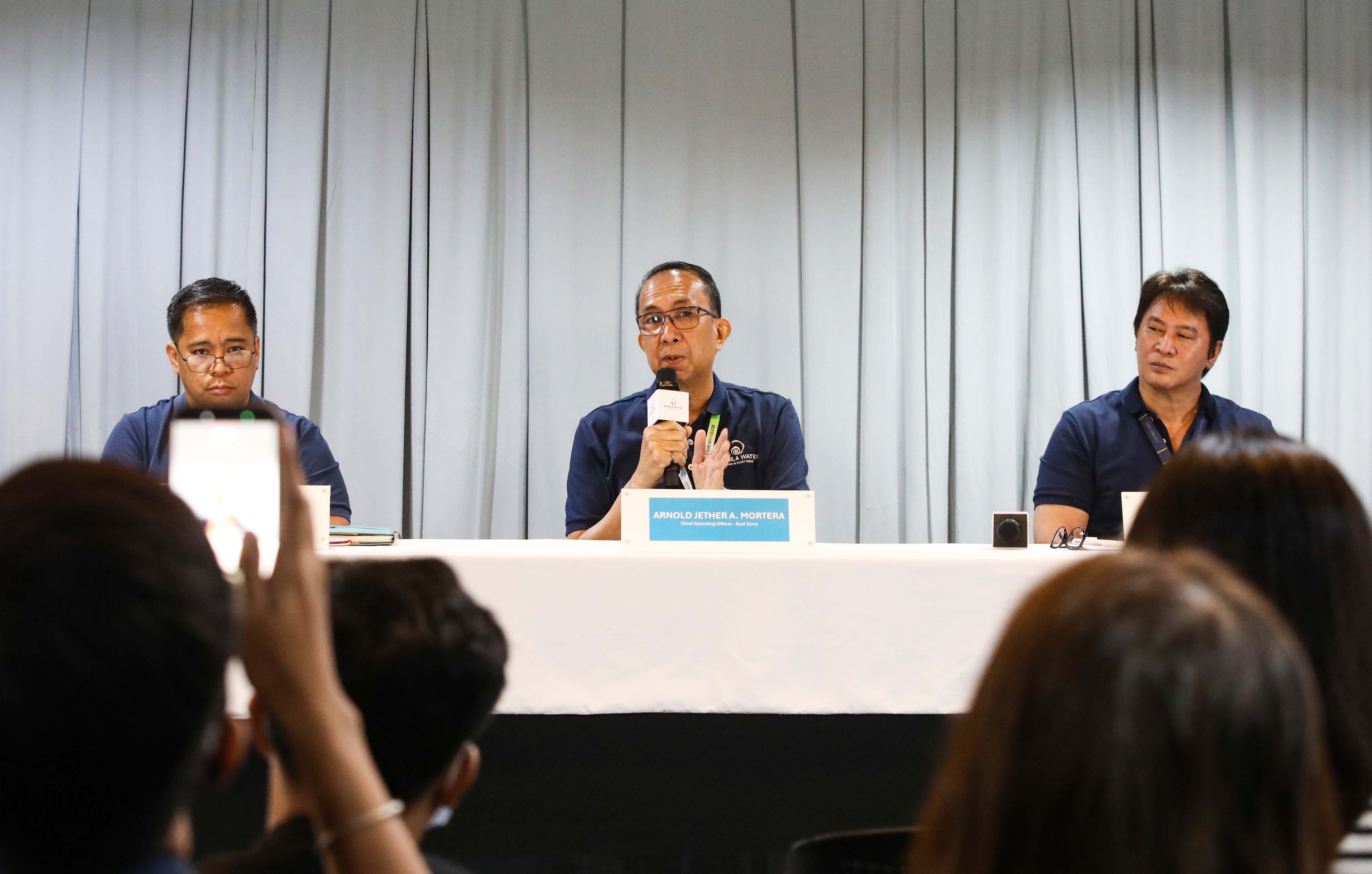(July 07 2026) Manila Water officials, Joemar B. Emboltorio, Operations Group Director-East Zone; Arnold Jether A. Mortera, Chief Operating Officer (East Zone); and Jeric T. Sevilla, Communication Affairs Group Director- Enterprise, hold a press briefing to discuss the company's water supply situation, how new water sources—including the Upper Wawa Dam and Laguna Lake—along with upcoming treatment facilities, have significantly strengthened Manila Water’s capability to provide reliable 24/7 water service even during prolonged dry spells. The company emphasized that these infrastructure investments and operational enhancements have positioned it to better withstand the impacts of a super El Niño while ensuring water security for customers across the East Zone, held at MWSS office in Quezon City, on Tuesday July 7 2026. Photo/Analy Labor