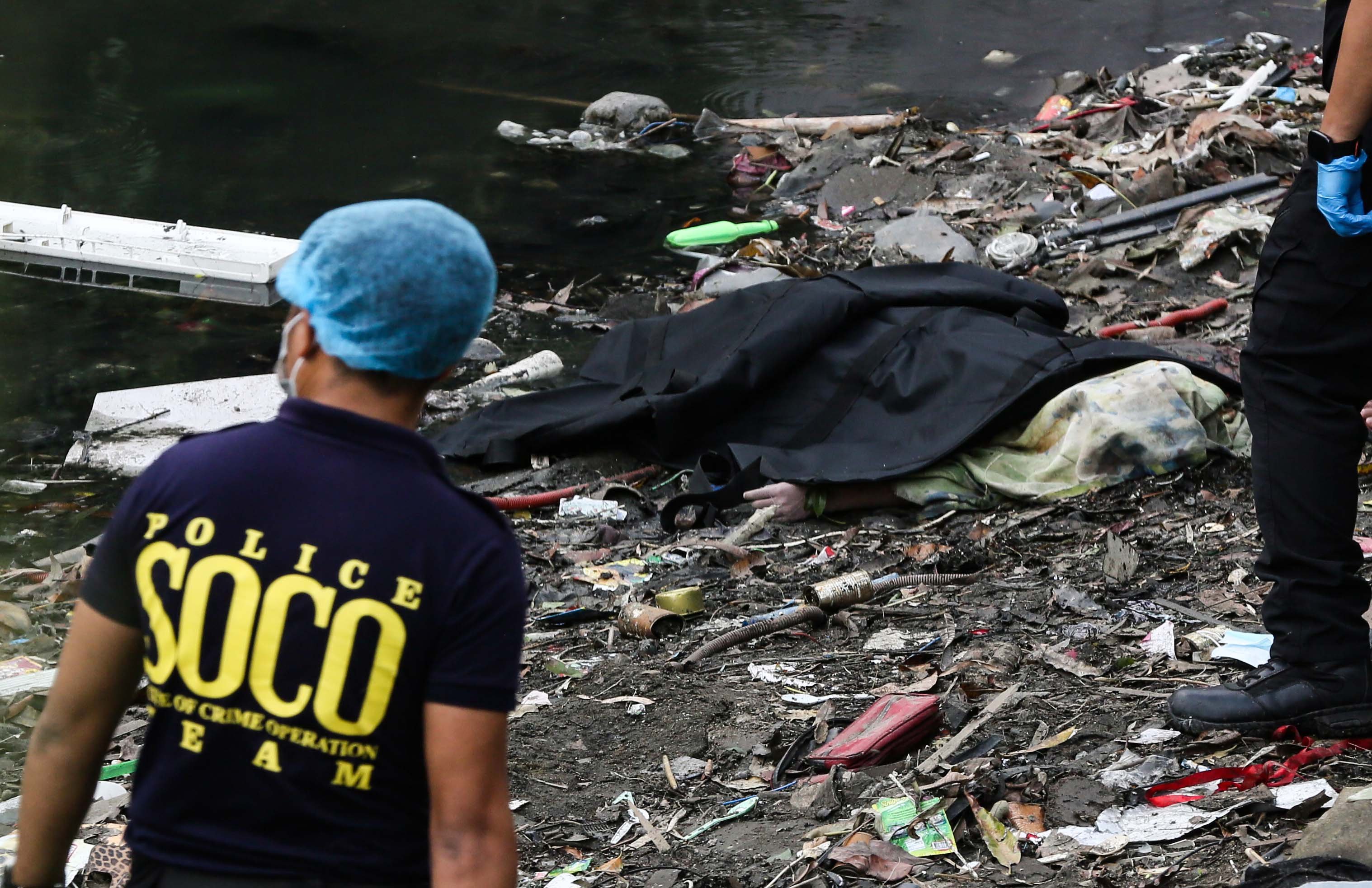 (July 07 2026) Scene of the Crime Operative SOCO investigate the lifeless body of the seven year old boy allegedly fell off at Dario river while flying a kite at Brgy. Bahay Toro in Quezon City on Monday afternoon, due to heavy rain and the water flow going strong the body was found at San Juan river in Brgy Apolonio Samson, Quezon City. Photo/Analy Labor