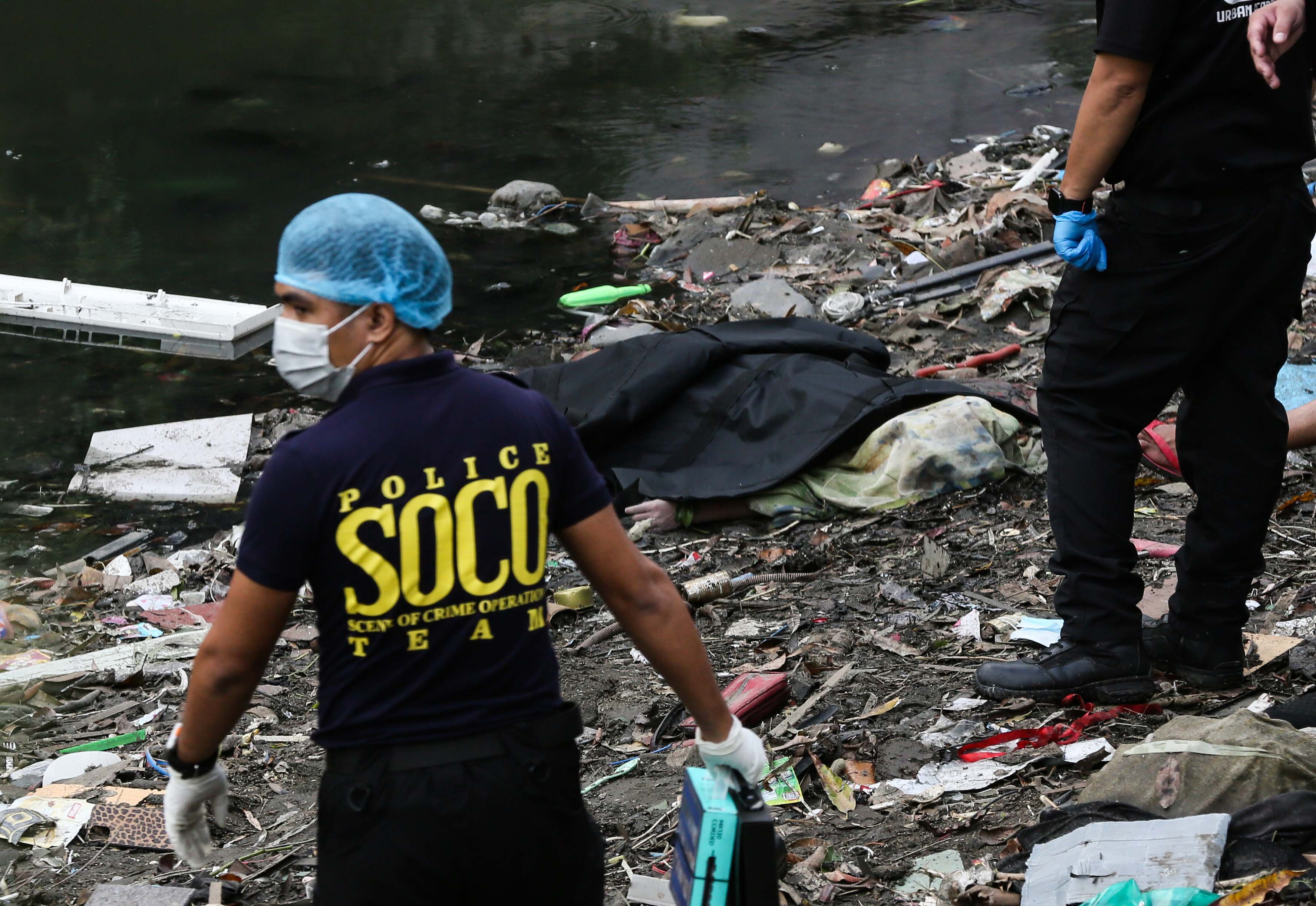(July 07 2026) Scene of the Crime Operative SOCO investigate the lifeless body of the seven year old boy allegedly fell off at Dario river while flying a kite at Brgy. Bahay Toro in Quezon City on Monday afternoon, due to heavy rain and the water flow going strong the body was found at San Juan river in Brgy Apolonio Samson, Quezon City. Photo/Analy Labor