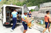 Personnel of Sabtang Police Station in coordination with Bureau of Fire Protection (BFP), and the Philippine Coast Guard (PCG) participated in pre-positioning of Family Food Packs (FFPs) in Brgy. Chavayan and Brgy. Savidug, Sabtang, Batanes, on Wednesday morning, 8:15 AM, as preparation for the Super Typhoon Inday. (PHOTO COURTESY OF SABTANG MUNICIPAL POLICE STATION)
