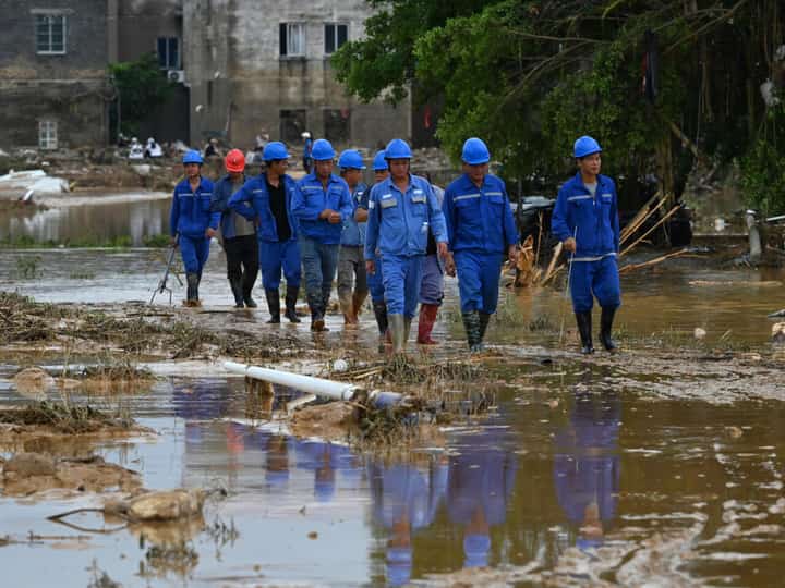 Rescuers search for missing in storms as 100,000 flee