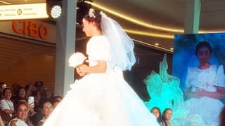 RUNAWAY little bride A shy Scarlet Snow Belo rushes to escape the spotlight as she models as a little bride, as proud parents, doctors Vicki Belo and Hayden Kho Jr. look on (not pictured).