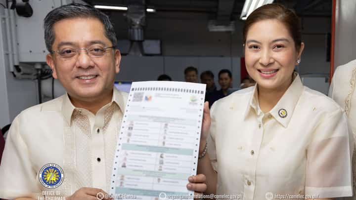 Comelec Chairman George Erwin Garcia shows off a printed sample ballot for the BARMM elections on 14 September 2026.