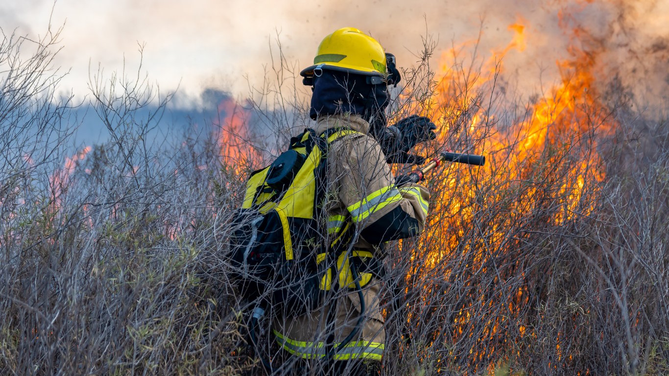 Eleven dead, 19 missing as wildfire roars through village