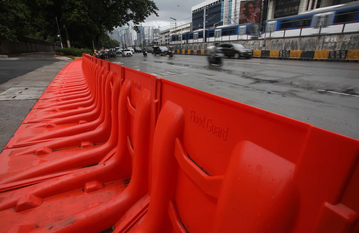(July 10 2026) In preparation for the impact of Inday, the MMDA has prepositioned flood barriers in front of Gate 4 of the Camp Aguinaldo in Quezon City on Friday, July 10, 2026, to block flood water flowing from the camp and prevent it from reaching EDSA. Photo/Analy Labor