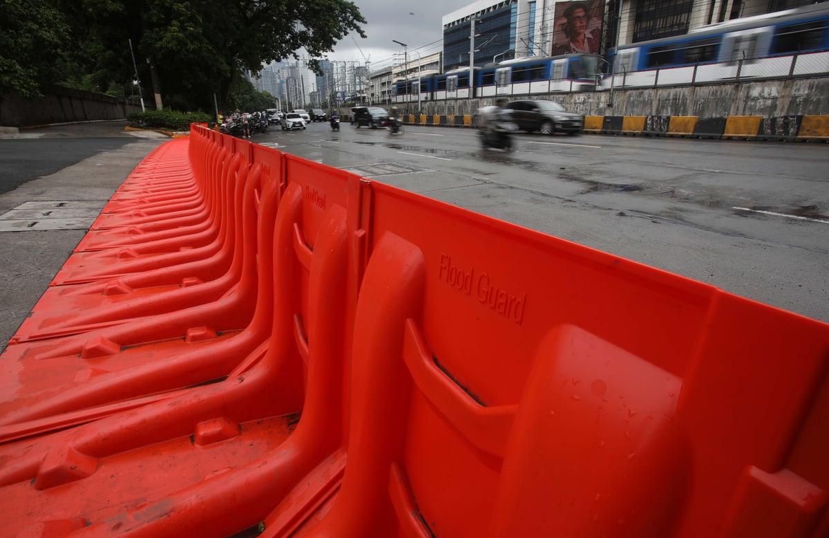 (July 10 2026) In preparation for the impact of Inday, the MMDA has prepositioned flood barriers in front of Gate 4 of the Camp Aguinaldo in Quezon City on Friday, July 10, 2026, to block flood water flowing from the camp and prevent it from reaching EDSA. Photo/Analy Labor