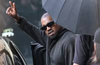 US rapper and producer Kanye West gestures upon arriving at Shanghai Pudong International Airport on 11 July, 2025.