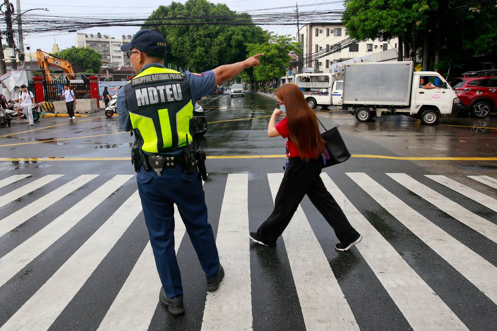 Concrete barriers, razor wire, and container vans block roads leading to the Malacañang Complex in Manila on 10 July 2026 as authorities tighten security ahead of an anti-corruption protest at Liwasang Bonifacio organized by an interfaith group.