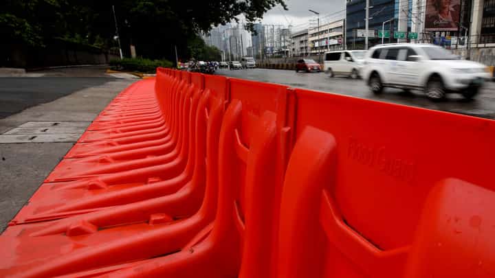(July 10 2026) In preparation for the impact of Inday, the MMDA has prepositioned flood barriers in front of Gate 4 of the Camp Aguinaldo in Quezon City on Friday, July 10, 2026, to block flood water flowing from the camp and prevent it from reaching EDSA. Photo/Analy Labor