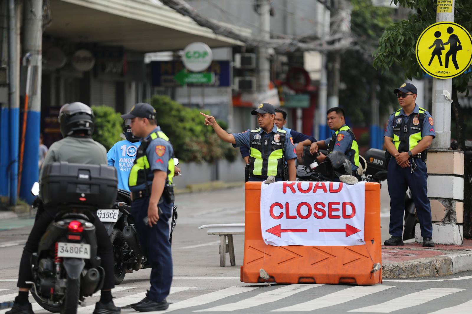 Concrete barriers, razor wire, and container vans block roads leading to the Malacañang Complex in Manila on 10 July 2026 as authorities tighten security ahead of an anti-corruption protest at Liwasang Bonifacio organized by an interfaith group.