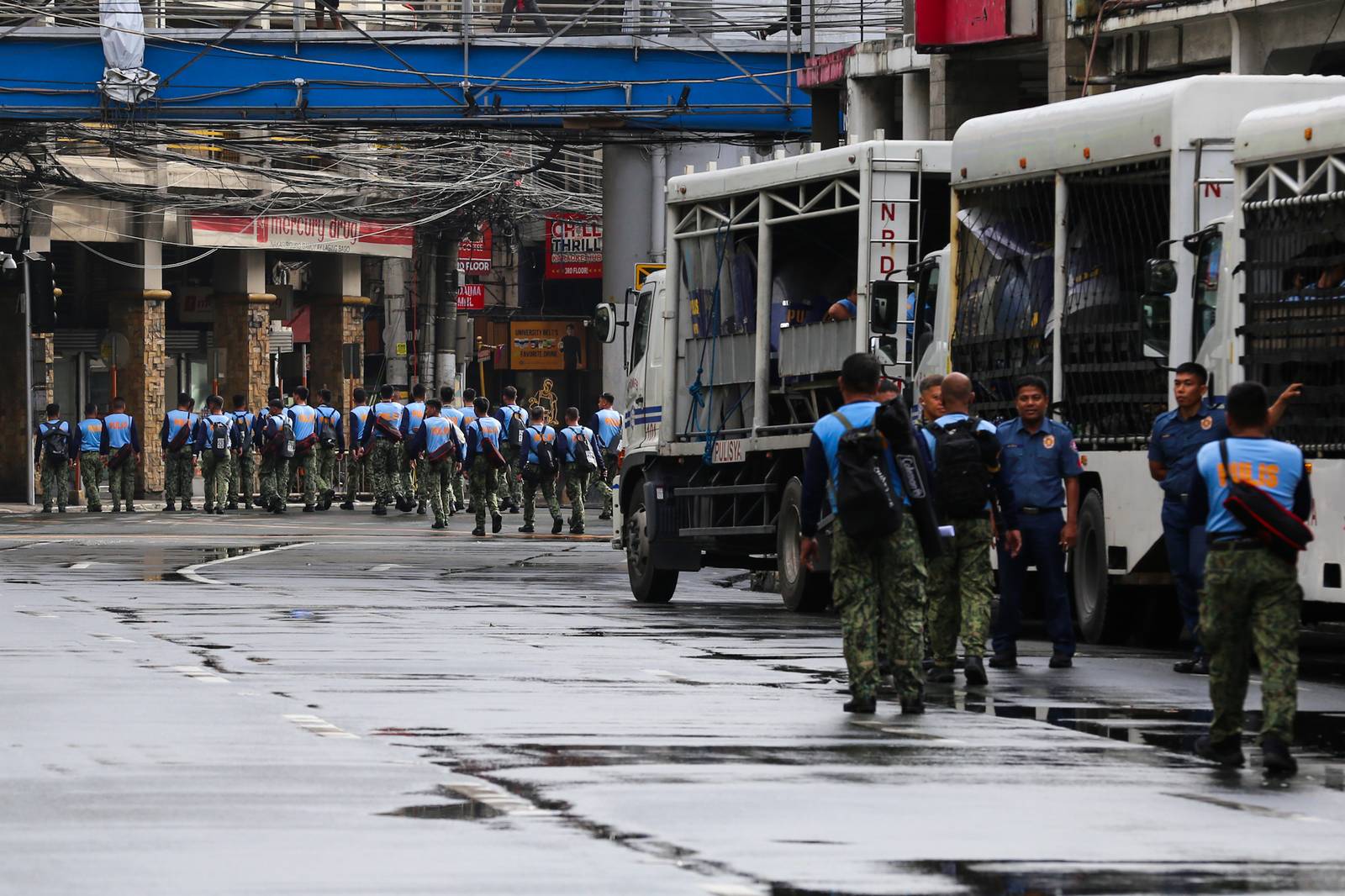 Concrete barriers, razor wire, and container vans block roads leading to the Malacañang Complex in Manila on 10 July 2026 as authorities tighten security ahead of an anti-corruption protest at Liwasang Bonifacio organized by an interfaith group.