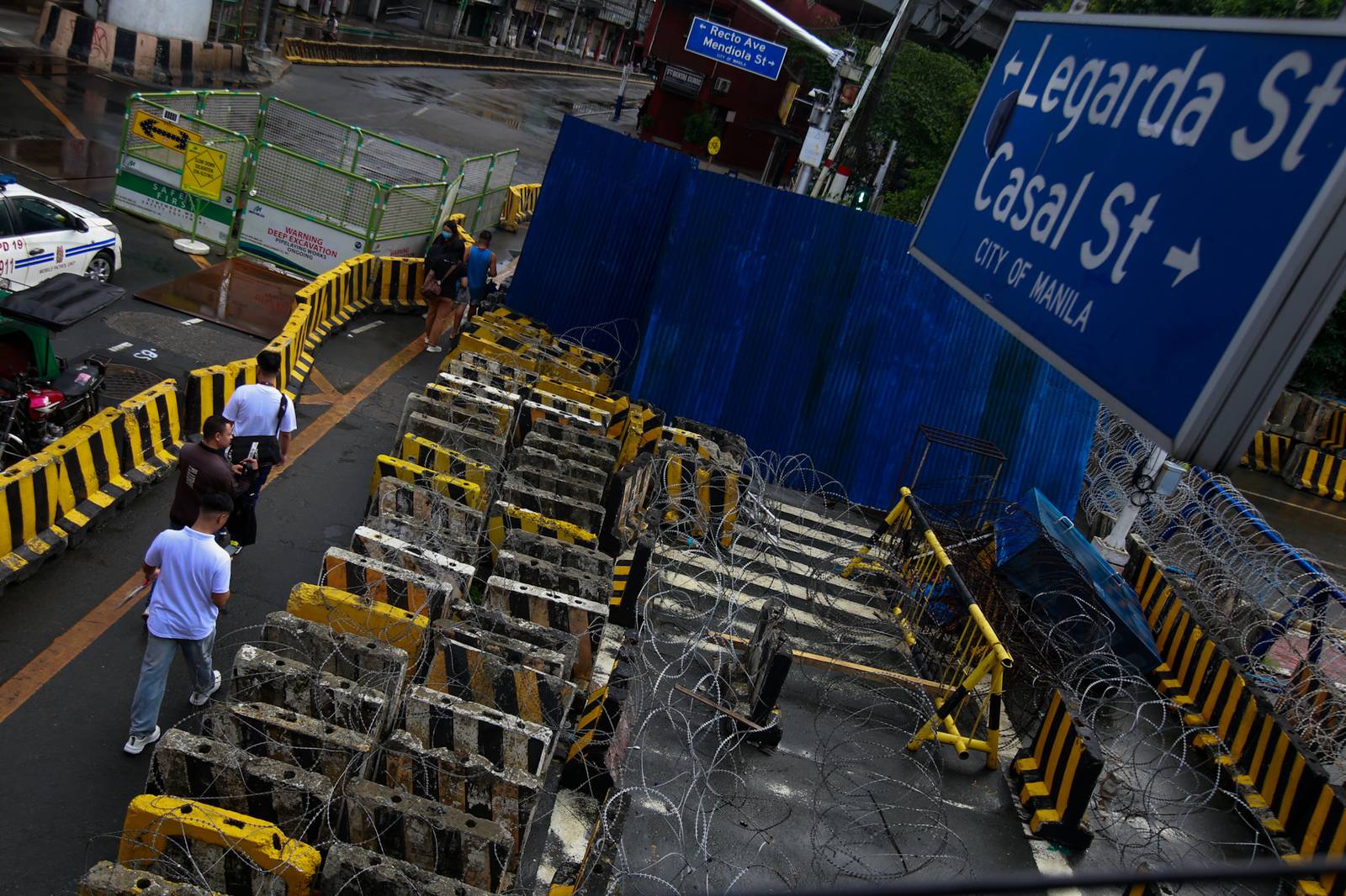 Concrete barriers, razor wire, and container vans block roads leading to the Malacañang Complex in Manila on 10 July 2026 as authorities tighten security ahead of an anti-corruption protest at Liwasang Bonifacio organized by an interfaith group.