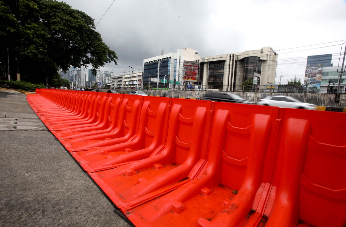 (July 10 2026) In preparation for the impact of Inday, the MMDA has prepositioned flood barriers in front of Gate 4 of the Camp Aguinaldo in Quezon City on Friday, July 10, 2026, to block flood water flowing from the camp and prevent it from reaching EDSA. Photo/Analy Labor