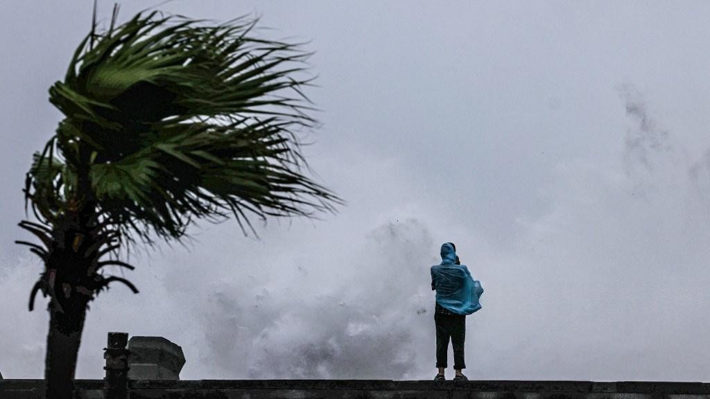 Over 900,000 people flee as typhoon lashes