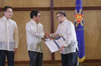 WITH Department of Finance Secretary Frederic D. Go standing beside him, President Ferdinand R. Marcos, Jr. congratulates PCSO general manager of the Philippine Charity Sweepstakes office general manager Melquiades A. Robles for PCSO's being among the top government-owned-and-controlled corporations which have substantially contributed dividends to the national government this year.