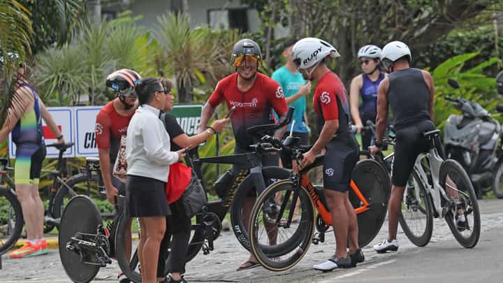 ATHLETES share a light moment before taking on the official bike route familiarization, an essential part of their preparations for the 5150 Bohol Triathlon.