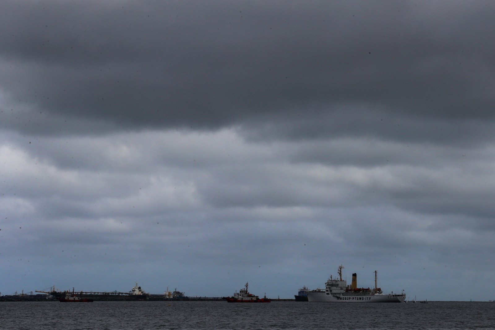 Dark clouds gather over Manila Bay as Typhoon Inday weakens and exits the Philippine Area of Responsibility on 11 June 2026. Face-to-face classes for tertiary and postgraduate students in public and private schools in the City of Manila have been suspended due to forecasts of moderate to heavy rainfall throughout the day.
