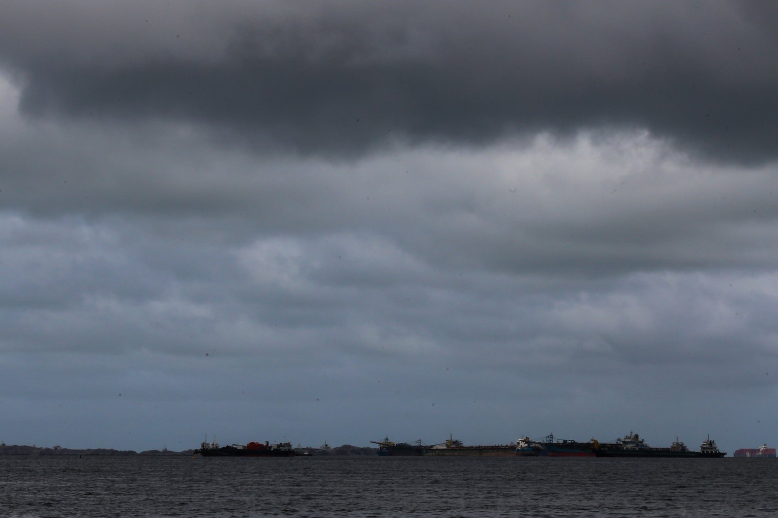 Dark clouds gather over Manila Bay as Typhoon Inday weakens and exits the Philippine Area of Responsibility on 11 June 2026. Face-to-face classes for tertiary and postgraduate students in public and private schools in the City of Manila have been suspended due to forecasts of moderate to heavy rainfall throughout the day.