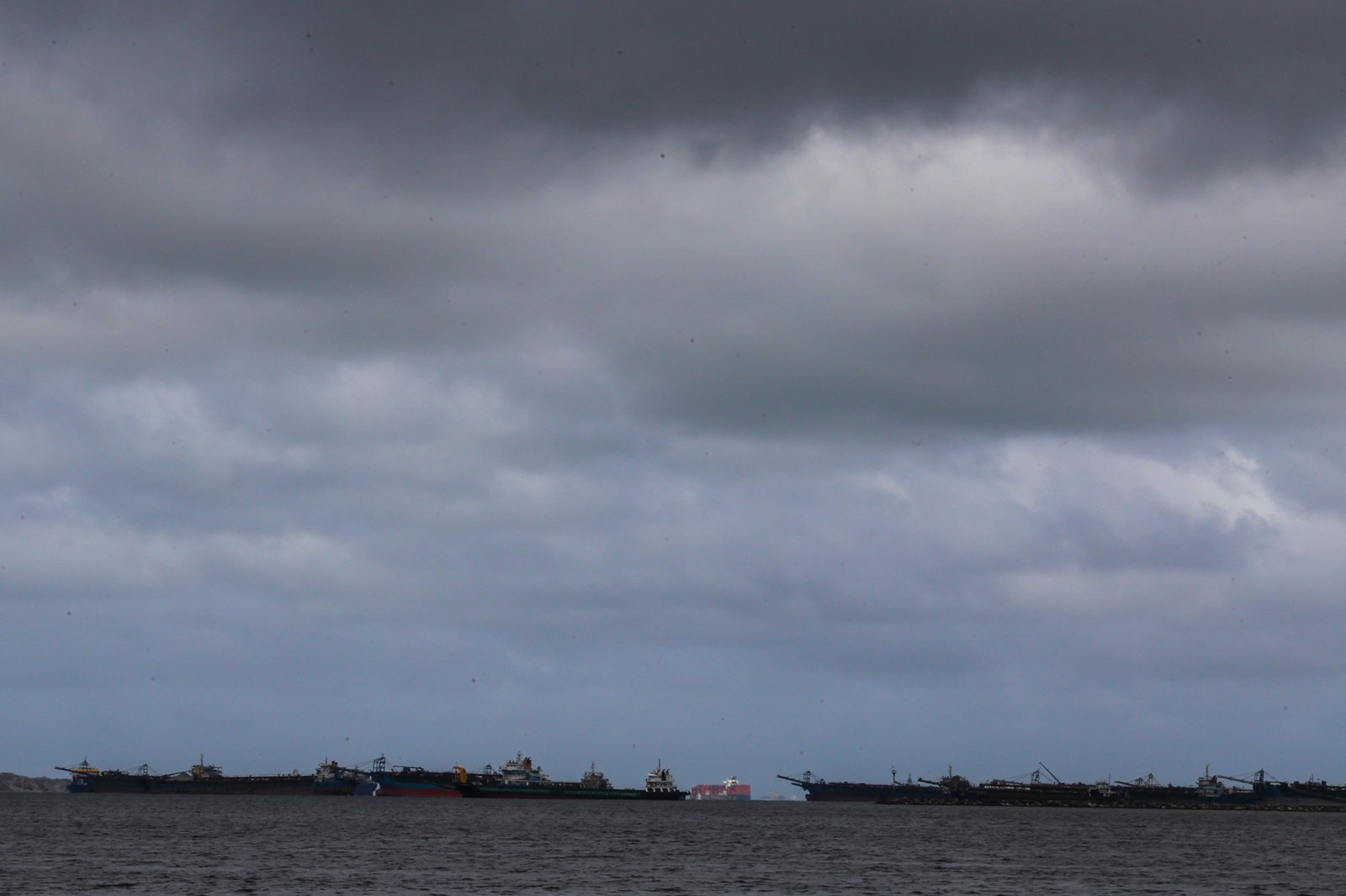 Dark clouds gather over Manila Bay as Typhoon Inday weakens and exits the Philippine Area of Responsibility on 11 June 2026. Face-to-face classes for tertiary and postgraduate students in public and private schools in the City of Manila have been suspended due to forecasts of moderate to heavy rainfall throughout the day.