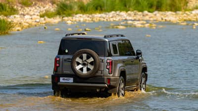 WADING through shallow water, the BAIC B40e Trailmaster rEV shows the off-road ability behind its electrified drive system.