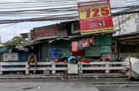 A fourth-alarm fire razed 46 houses beneath Culiat Bridge II along Congressional Avenue in Quezon City on Saturday night before it was declared out at 11:26 p.m. The Quezon City government said 38 families were affected, including residents of a nearby house. Authorities continue to assess the damage, with road closures in place as investigators examine the area, where damaged utility lines and a long crack on the bridge's asphalt surface were observed.