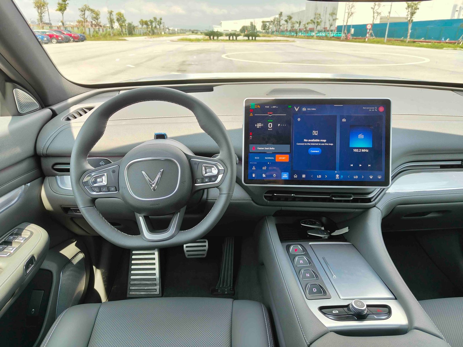 VIEWED from the driver’s seat, the VinFast VF 9 cabin features a wide central display and a clean control layout.