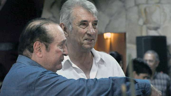 CONMEBOL president Nicolas Leoz (L) speaks with former Argentine footballer Antonio Ubaldo Rattin during a meeting at Leoz's country residence, El Arriero, in Ypacarai, 40 km from Asuncion, on January 28, 2009. Former midfielder Antonio Ubaldo Rattin, regarded as one of the greatest idols in Boca Juniors' history, died on July 11, 2026, at the age of 89, according to the club.