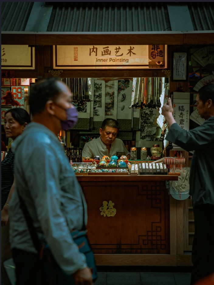 The shop features glass and snuff bottles decorated using Neihua, the art of painting inside the bottle.