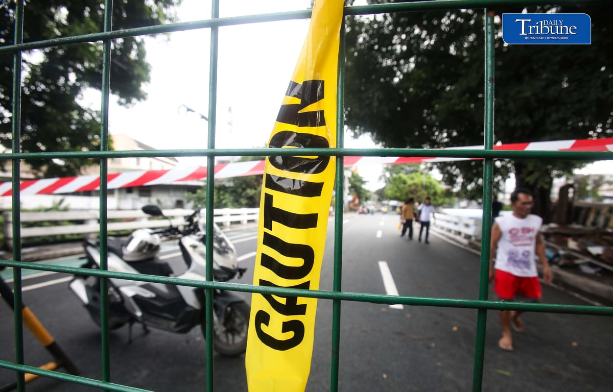 (July 13 2026) The Congressional Avenue bridge in Barangay Bahay Toro on Monday July 13 2026, remains closed to vehicles to ensure the safety of motorists and residents passing through, After a 4th alarm fire hit the area on Saturday night July 11 2026. The bridge is deemed unsafe for any vehicle because parts of it have lifted due to the heat generated by the fire. Photo/Analy Labor