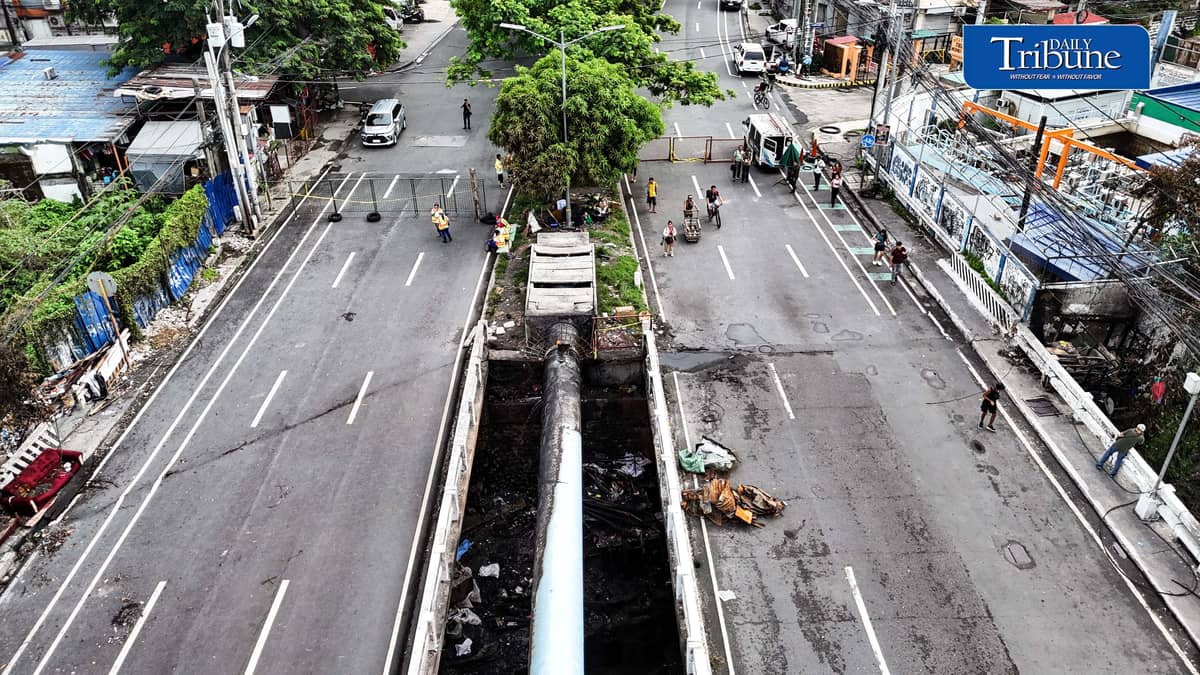 (July 13 2026) The Congressional Avenue bridge in Barangay Bahay Toro on Monday July 13 2026, remains closed to vehicles to ensure the safety of motorists and residents passing through, After a 4th alarm fire hit the area on Saturday night July 11 2026. The bridge is deemed unsafe for any vehicle because parts of it have lifted due to the heat generated by the fire. Photo/Analy Labor
