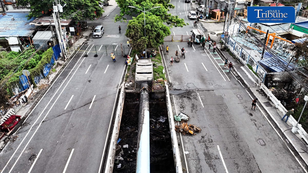(July 13 2026) The Congressional Avenue bridge in Barangay Bahay Toro on Monday July 13 2026, remains closed to vehicles to ensure the safety of motorists and residents passing through, After a 4th alarm fire hit the area on Saturday night July 11 2026. The bridge is deemed unsafe for any vehicle because parts of it have lifted due to the heat generated by the fire. Photo/Analy Labor