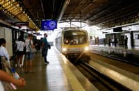 Passengers queue along the platform while waiting for an incoming train at the LRT-2 Cubao Station in Quezon City.