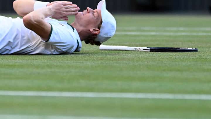 JANNIK Sinner lies down in celebration after pulling off a bruising four-set win over Alexander Zverev to defend his men’s singles title in the Wimbledon Championships.