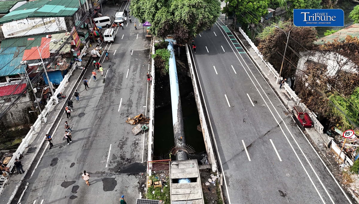 (July 13 2026) The Congressional Avenue bridge in Barangay Bahay Toro on Monday July 13 2026, remains closed to vehicles to ensure the safety of motorists and residents passing through, After a 4th alarm fire hit the area on Saturday night July 11 2026. The bridge is deemed unsafe for any vehicle because parts of it have lifted due to the heat generated by the fire. Photo/Analy Labor