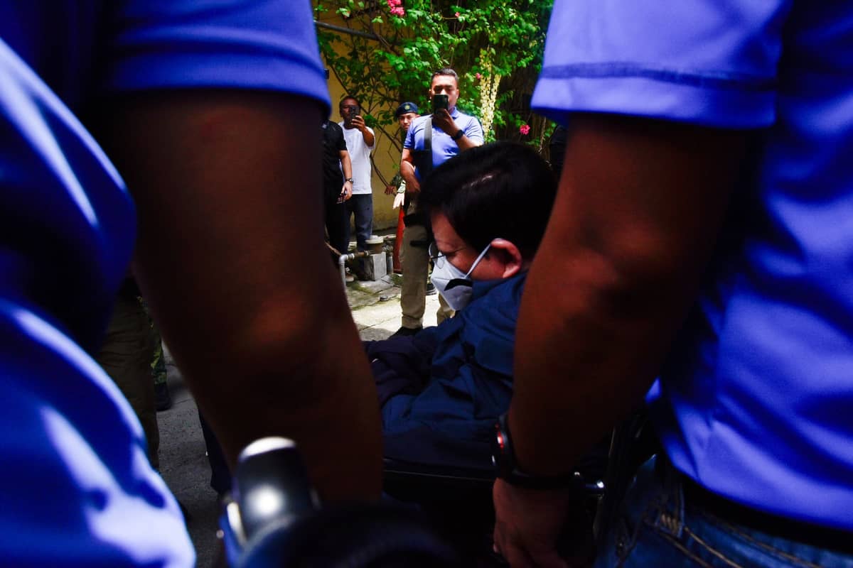 Sen. Rodante Marcoleta arrives at the Philippine General Hospital in a wheelchair under the escort of Criminal Investigation and Detection Group personnel. l Zedrich Xylak Madrid