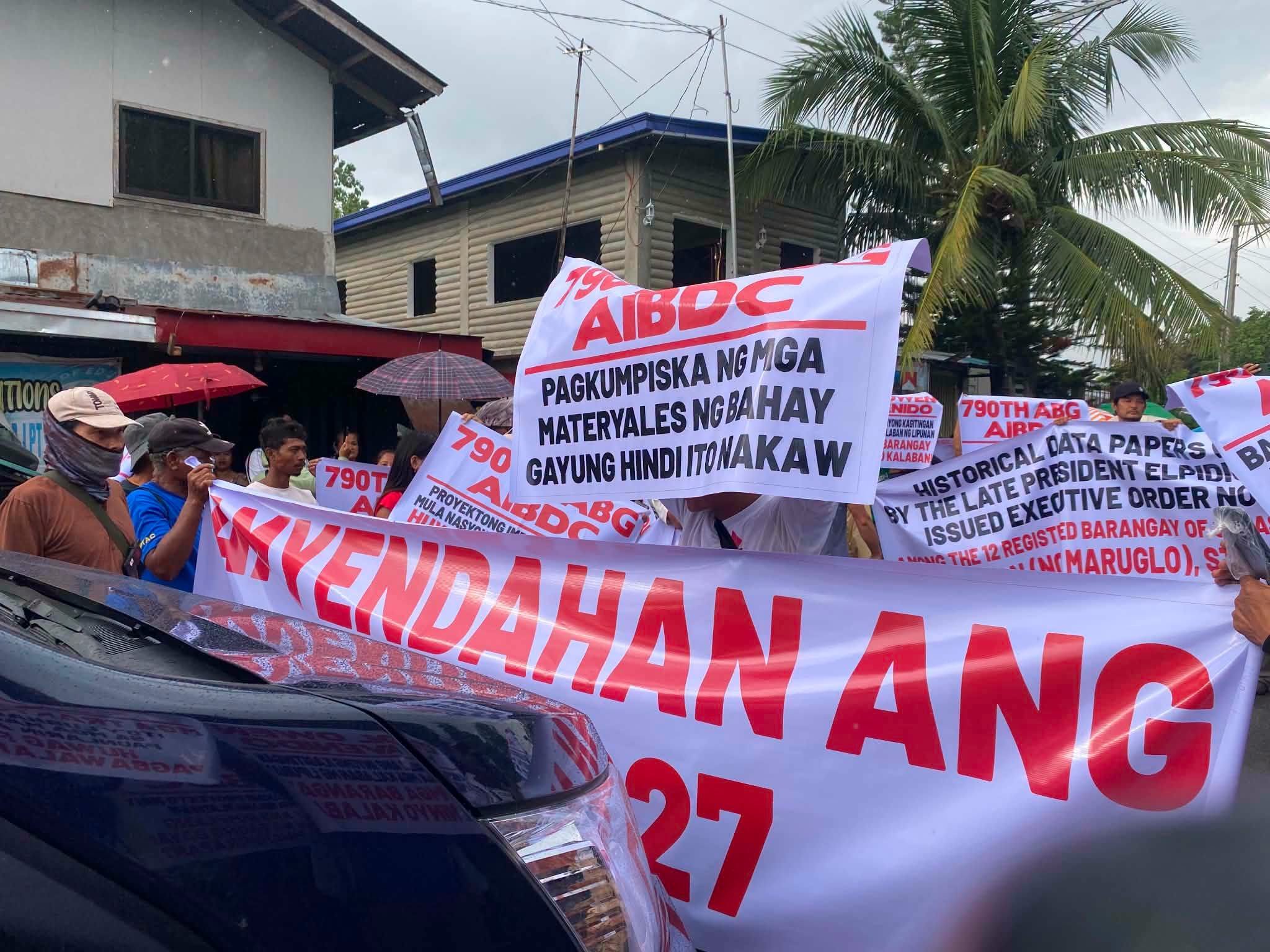 Residents hold protest over PAF’s stringent measures at barangays within CERAB in Capas