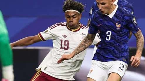Lamine Yamal dribbles past Lucas Digne in World Cup semifinal.