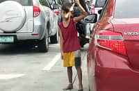 CHILDHOOD interrupted A young sampaguita vendor waits for customers along Roxas Boulevard, corner P. Ocampo Street in Manila. While many children continue to work on the streets to support their families, the Philippine Statistics Authority reported that the number of working children aged 5 to 17 rose to 868,540 in 2025, up from the previous year. The sight of children earning a living instead of enjoying their childhood underscores the continuing challenge of eliminating child labor.