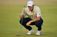 RORY McIlroy of Northern Ireland lines up a putt on the 14th green.