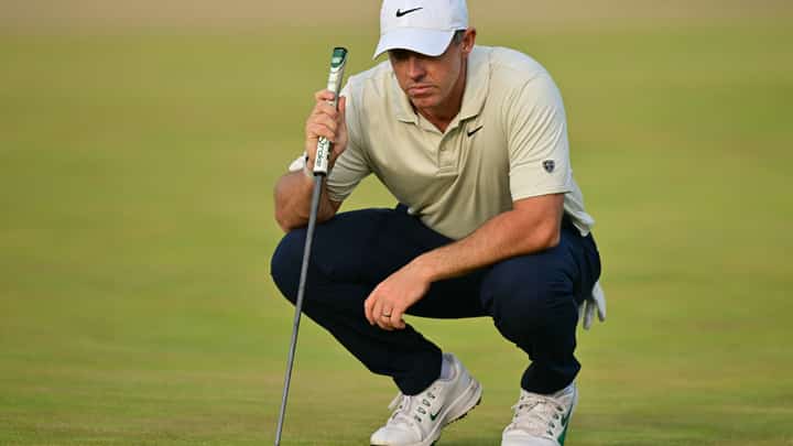 RORY McIlroy of Northern Ireland lines up a putt on the 14th green.