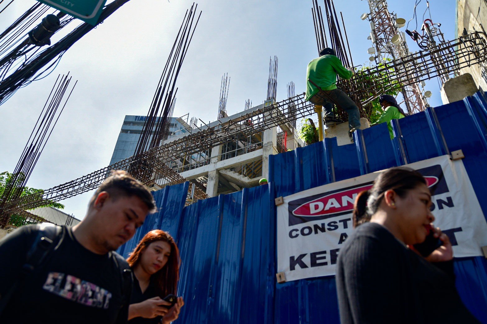 Workers and pedestrians doing their day-to-day routine in Manila